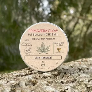 2oz can of Primavera Glow Balm with Hemp CBD and Geranium and Shea for beautiful skin OneBody Botanicals