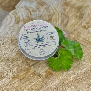 1oz can of Primavera Glow Balm with Hemp CBD and Geranium and Shea for beautiful skin OneBody Botanicals