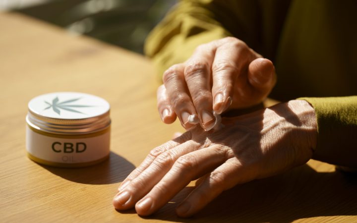 close-up-woman-using-cbd-cream-pain